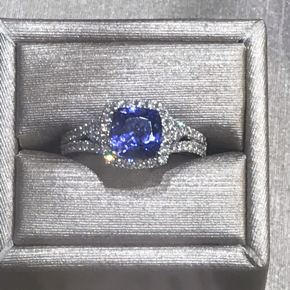 ISO - blue tanzanite & diamond halo ring